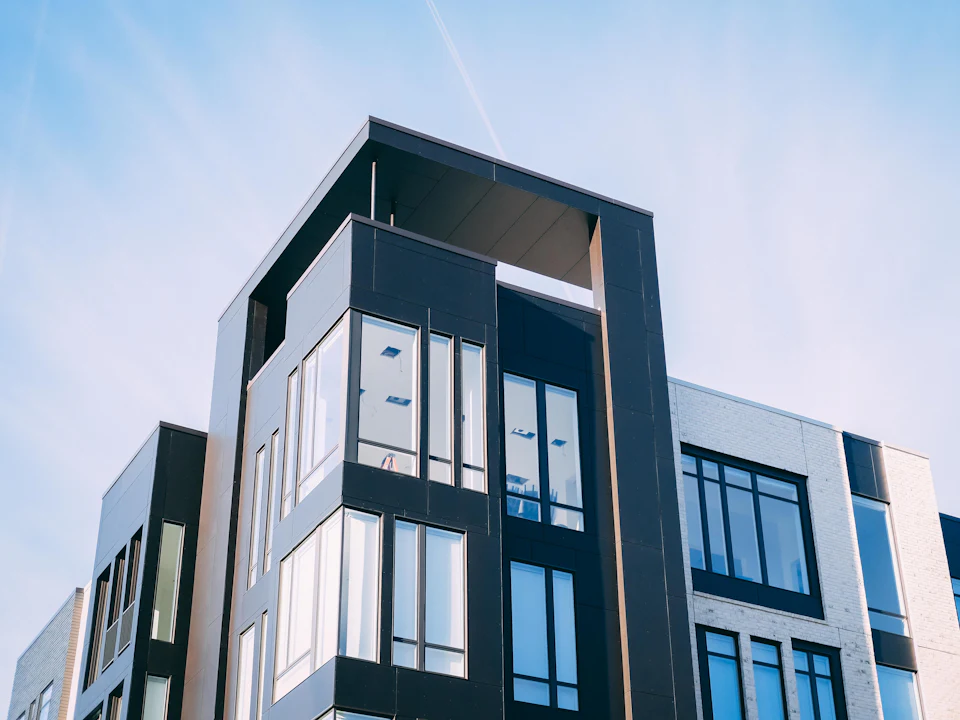 Modern residential building with dark glass and clean lines